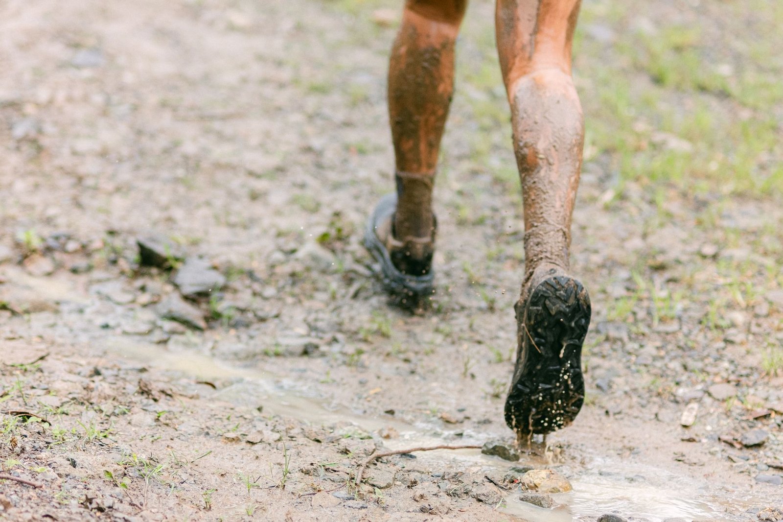 mud covered legs during a trail run adventure
