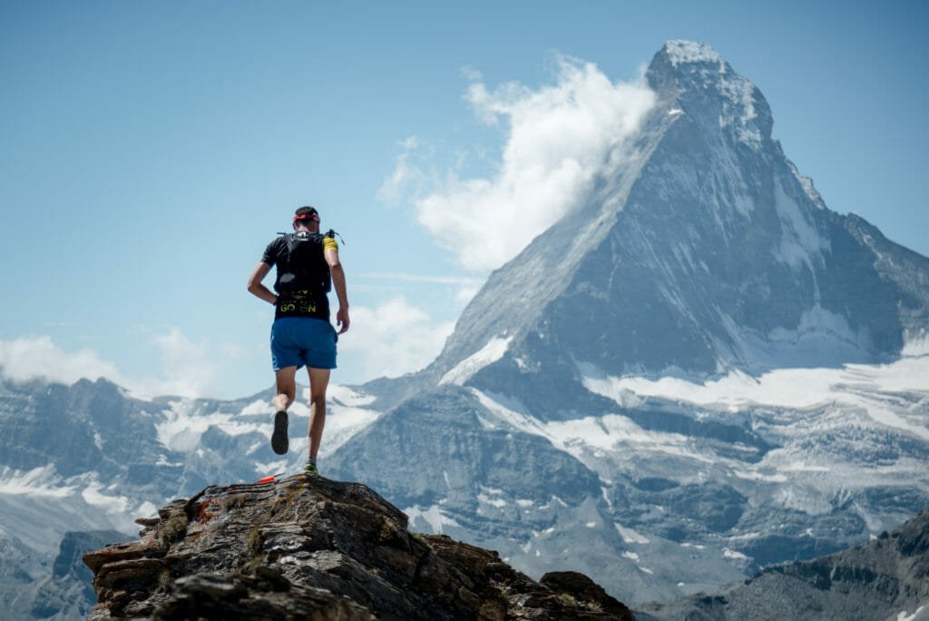 Skyrunner crossing the glacier suspension bridge during the Matterhorn Ultraks race.