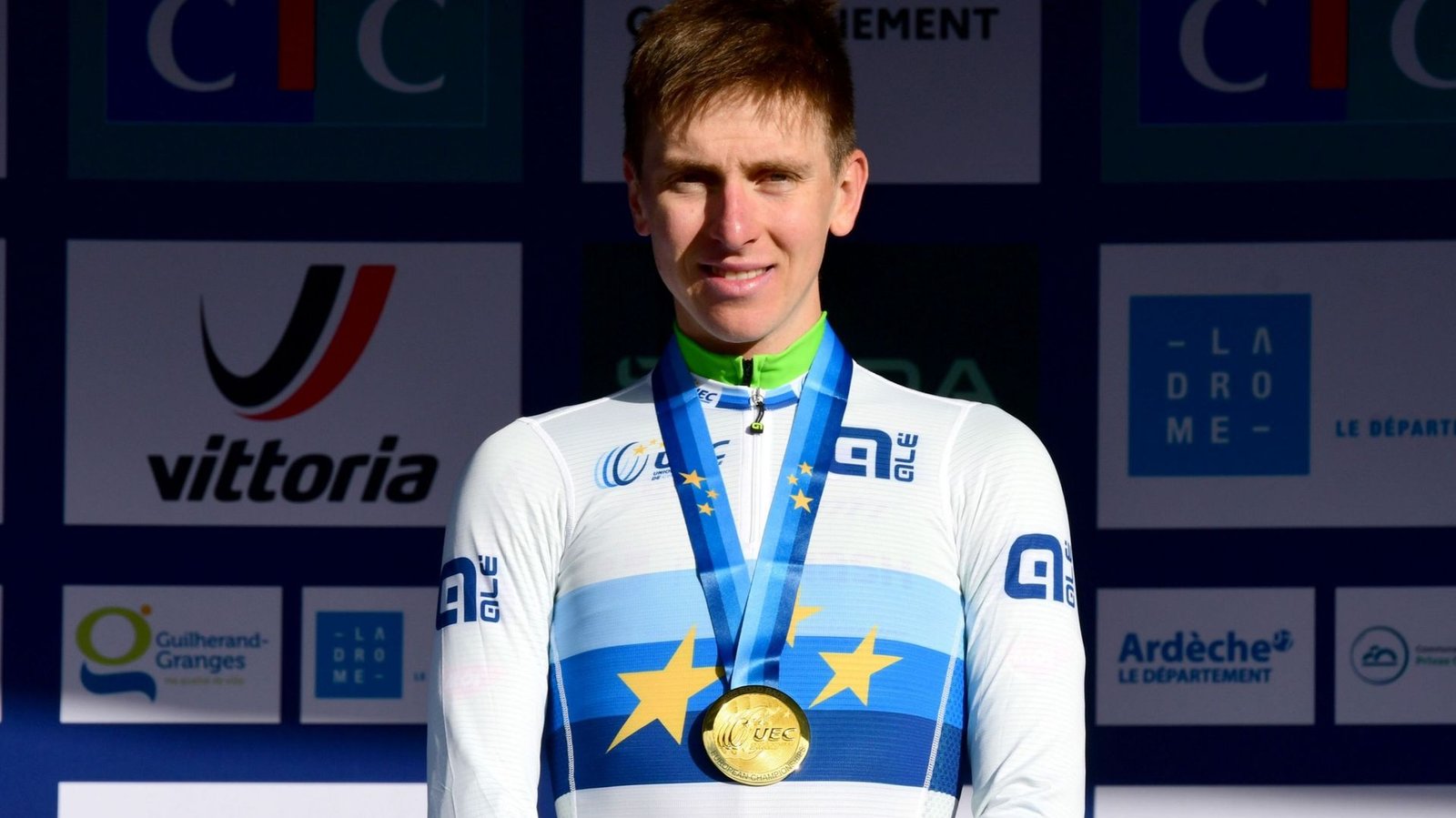 Tadej Pogačar wearing the world champion rainbow jersey during a 2026 road race