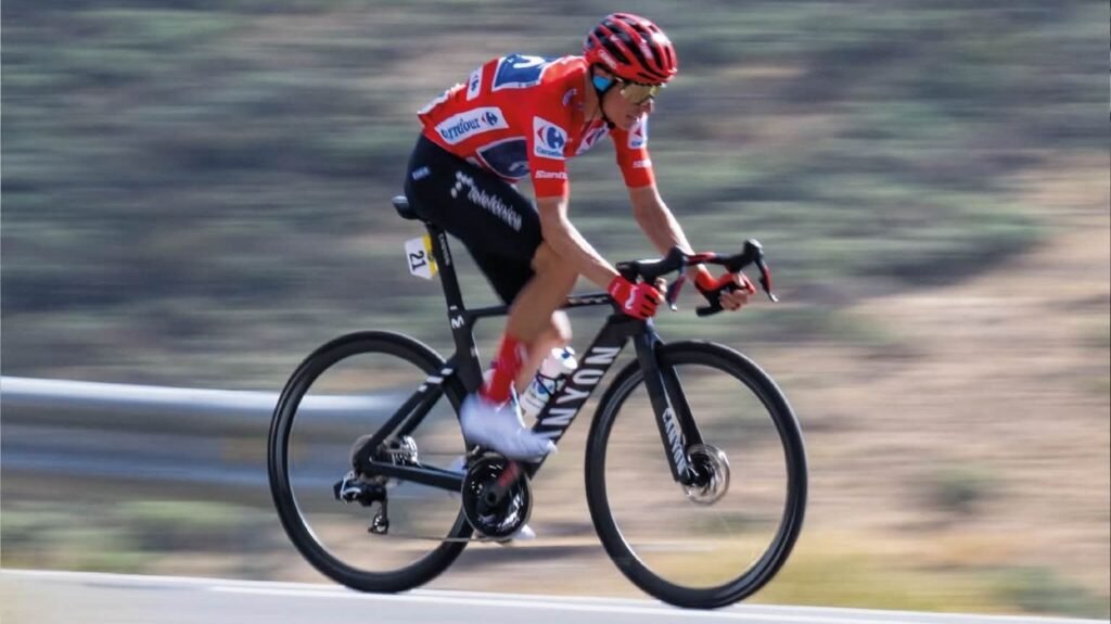 Enric Mas in the red jersey