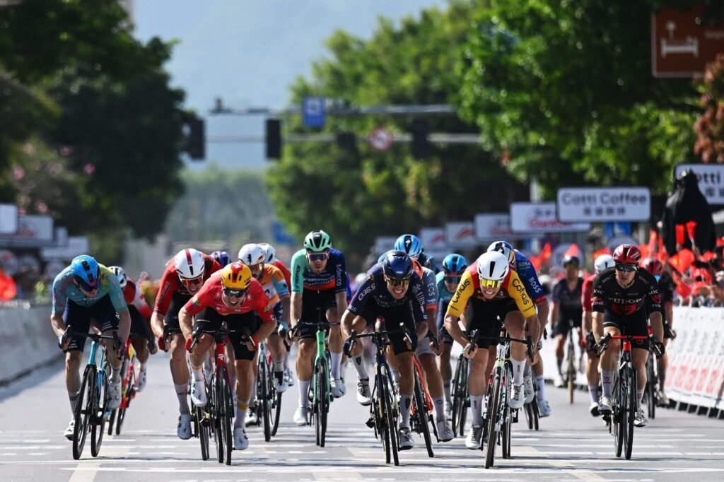 Peloton racing past towering karst mountains and rivers during the Guilin circuit finale in Tour of Guangxi.