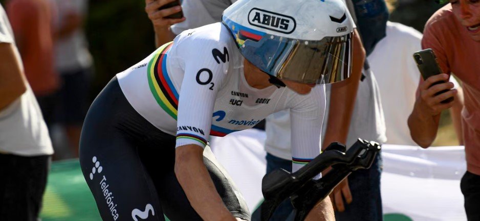 Close-up of Marlen Reusser in full aero tuck position during an individual time trial race.