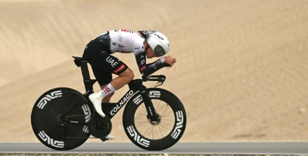 Tadej Pogačar riding in full aero position during a Grand Tour individual time trial stage.